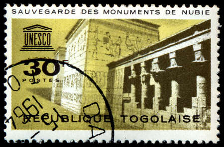 TOGO - CIRCA 1964: A stamp printed in Togo shows the Monuments of Nubia with inscription and name of the series \" Save the Monuments of Nubia\", circa 1964のeditorial素材