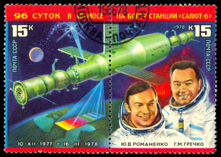 USSR - CIRCA 1978: A post stamp printed in USSR shows russian astronauts Yuri Romanenko and Georgiy Grechko. Circa 1978のeditorial素材