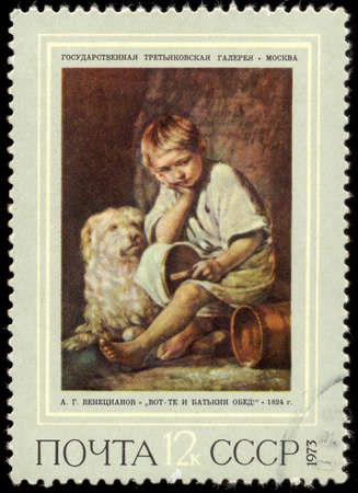 RUSSIA - CIRCA 1973: stamp printed by Russia, shows Boy with Dog (That was my FatherA?A???s Dinner), by A. Venetsianov, circa 1973のeditorial素材