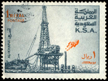 SAUDI ARABIA - CIRCA 1976: a stamp printed in the Saudi Arabia shows Al Khafji Oil Rig, circa 1976のeditorial素材