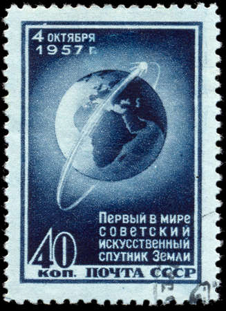 USSR - CIRCA 1957: stamp printed by Russia, shows Sputnik 1 Circling Globe, circa 1957のeditorial素材