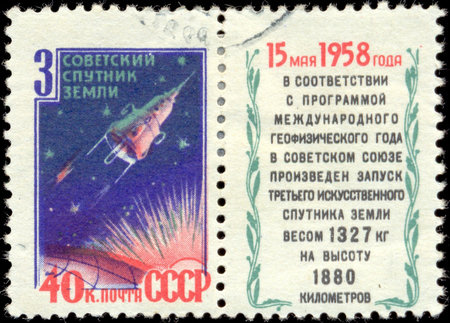 RUSSIA - CIRCA 1958: stamp printed by Russia, shows globe and rockets, circa 1958.のeditorial素材