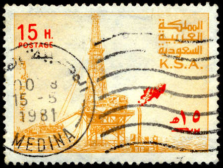 SAUDI ARABIA - CIRCA 1976: a stamp printed in the Saudi Arabia shows Al Khafji Oil Rig, circa 1976のeditorial素材