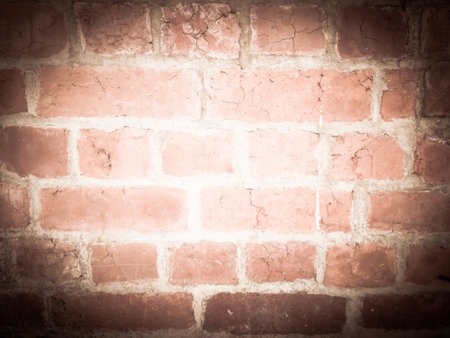 Vignette of an old red brick wall It is a background and texture that gives a mysterious feeling to findの写真素材
