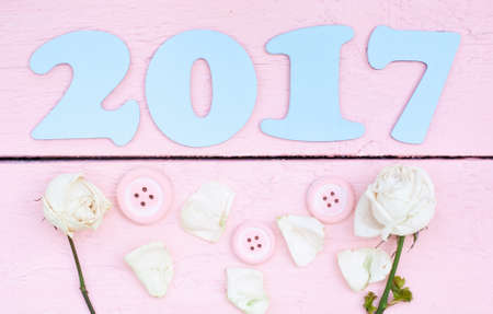 2017 Light blue and white roses on a pink wood backgroundの写真素材