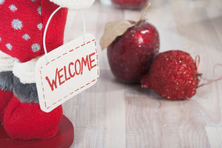 Christmas decoration with red apple and welcome signboardの写真素材