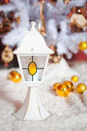 Christmas light interior with white lamp and gold toysの写真素材