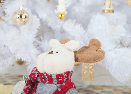 White Christmas tree, gold toys and deerの写真素材