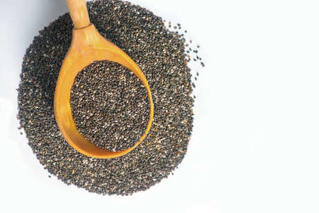 Chia seeds. Chia word made from chia seeds. Chia seeds in wooden spoon. Chia seeds isolated on white.の写真素材
