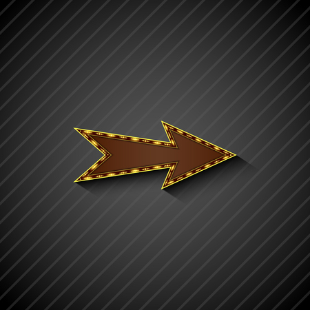 An arrow sign with light bulbs on black backgroundの写真素材