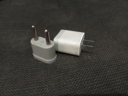 Close up of a power plug on a black background