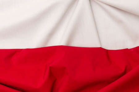 Folded nylon and cotton fabric arranged in Polish flag. National colors of Poland. A horizontal bicolor of red and whiteの写真素材