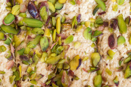 Full frame of pistachio nuts halva (halvah, halwa), top view textureの写真素材