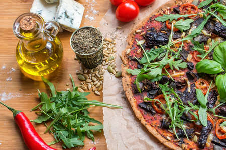 Vegan pizza marinara with spelt dough flat lay view. Italian traditional cuisine.の写真素材
