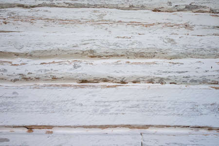 Natural wooden log cabin wall facade covered with white paint, full frame background.の写真素材