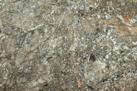 Salt crystals on rock salt (halite) wall in an underground salt mine. Natural beauty as background.