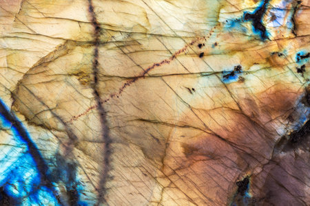 Polished labradorite natural mineral stone surface with an optical effect known as labradorescenceの写真素材