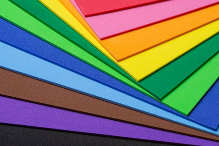 A mix of craft foam sheets in vibrant rainbow colorsの写真素材