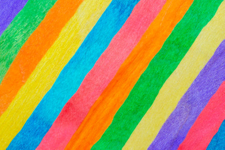 Multicolored stripes arranged diagonally. Rainbow colors. Colorful striped background textureの写真素材
