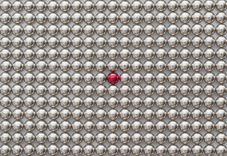 Full Frame of Metal Magnetic Balls for background. The Neocube Spheres with one red sphere. Stand out of the crowdの写真素材