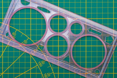 Spirograph drawing template with a ruler on a cutting matの写真素材