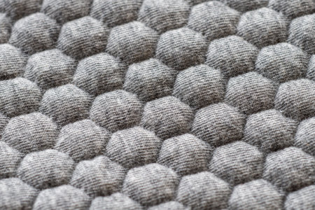 Gray fabric with hexagonal patternの写真素材
