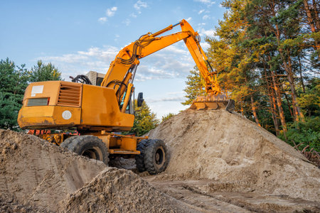 Wheeled excavator working on construction site