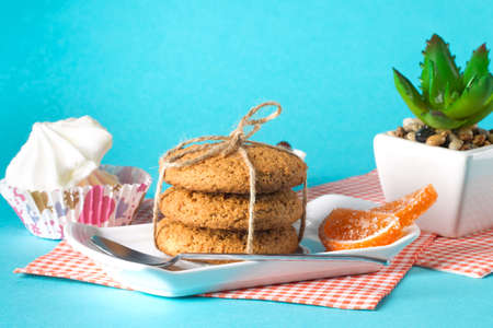 Cake and cookies on a bright background, morning breakfastの写真素材
