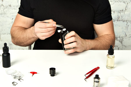 Maintenance of electronic mod vaping device.Modern vaporizer. Start vaping safe ecig vape. Master...
