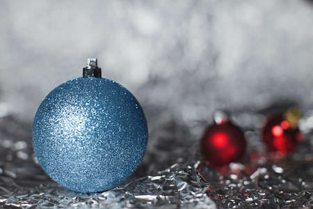 silvery and red christmas balls on a silvery backgroundの写真素材