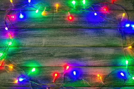 New Year's garland on a black background, shine lights, blur