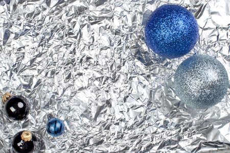 blue and silvery christmas balls on a silvery backgroundの写真素材