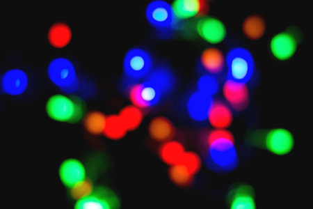 New Year's garland on a black background, shine lights, blurの写真素材