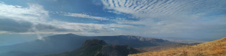 Crimean mountains valley with clouds at horizon and hills