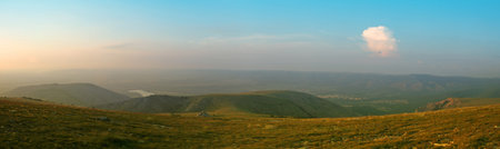 Sunset in mountain with cloud at horizon