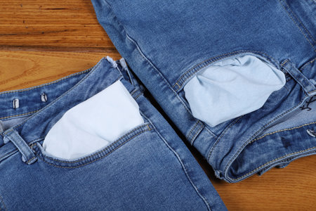 Blue jeans on wooden background. Jeans texture. top view Stone washed, no brand denim.の写真素材