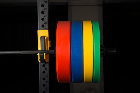 Barbells in the gym, isolated on black background, close upの写真素材