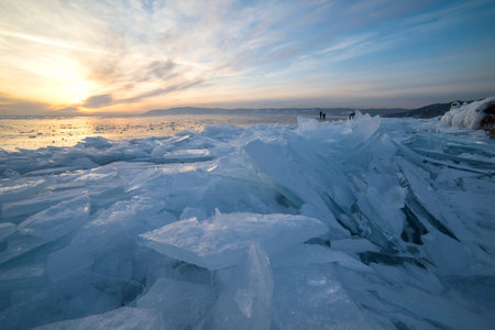 Ice of Baikal lake at sunset in Russia