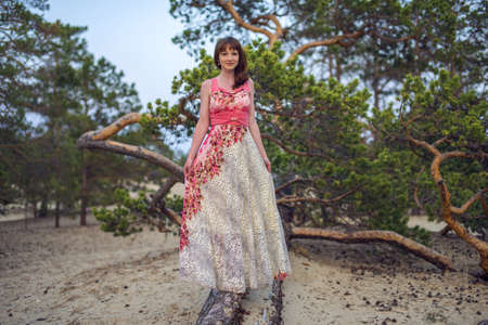 beautiful girl near a tree on the sand, Olkhon island, Baikalの写真素材