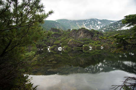 view reflection mountain lake, near lake Baikalの写真素材