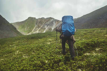 man climbs a mountain at the beautiful viewの写真素材