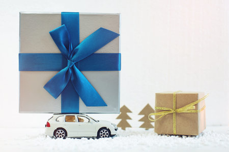 Toy car carries on the roof gift for Christmas and the new year