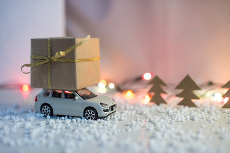 Toy car carries on the roof gift for Christmas and the new year