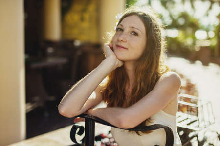 Woman relaxing and enjoying the warm sun in the Parkの写真素材