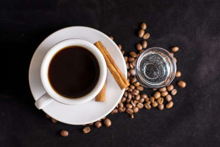 coffee, beans and cinnamon on dark backgroundの写真素材