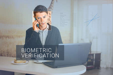 Recognition of a male face by layering a mesh and the calculation of the personal data by the software. Biometric verification and identificationの写真素材