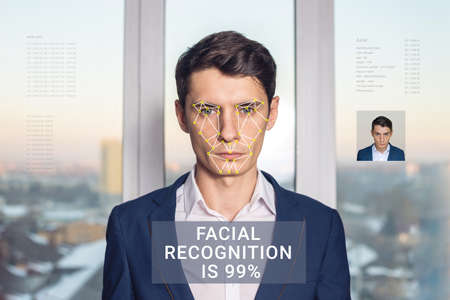 Recognition of a male face by layering a mesh and the calculation of the personal data by the software. Biometric verification and identificationの写真素材