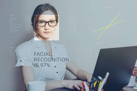Recognition of a female face by layering a mesh and the calculation of the personal data by the software. Biometric verification and identificationの写真素材