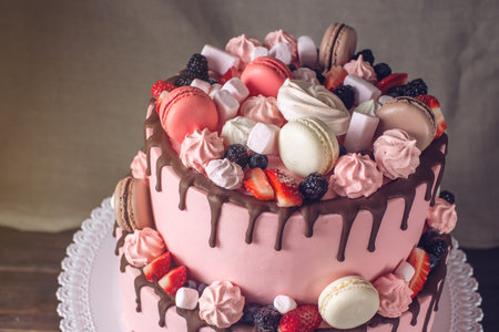 Pink 2 tiered cake rustic drizzled with chocolate, berries strawberries, blackberries, marshmallows...
