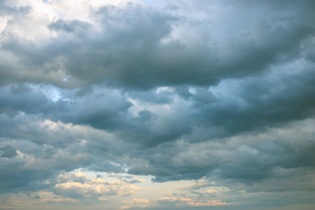 Dramatic view of sky with clouds at sunset. blue and yellow colors